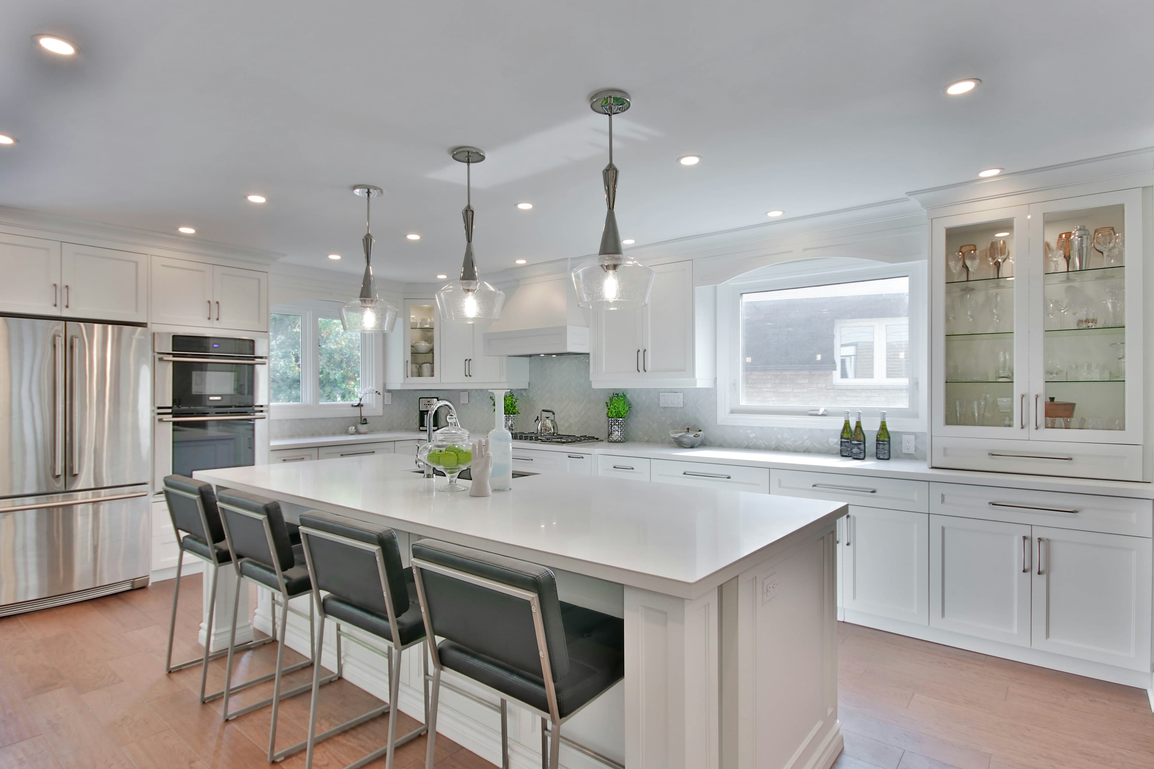 Modern desert kitchen with oak cabinetry and waterfall island